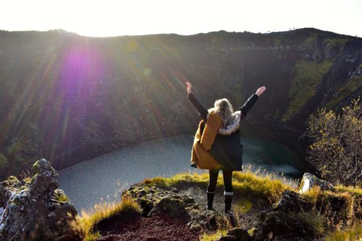 A student at the top of a valley.